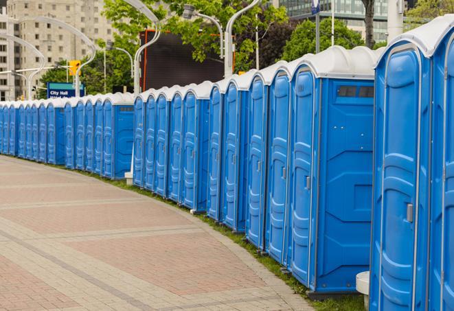 a line of portable restrooms at an outdoor wedding, catering to guests with style and comfort in Atascosa, TX